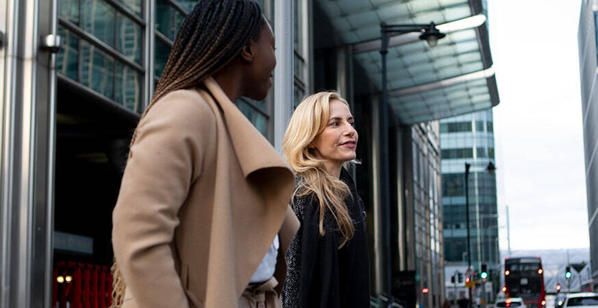 two women walking out of office